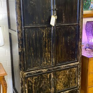 Provincial lacquered elm cabinet with two doors above two smaller doors and original iron hardware, has been used as an entertainment unit China circa 1920